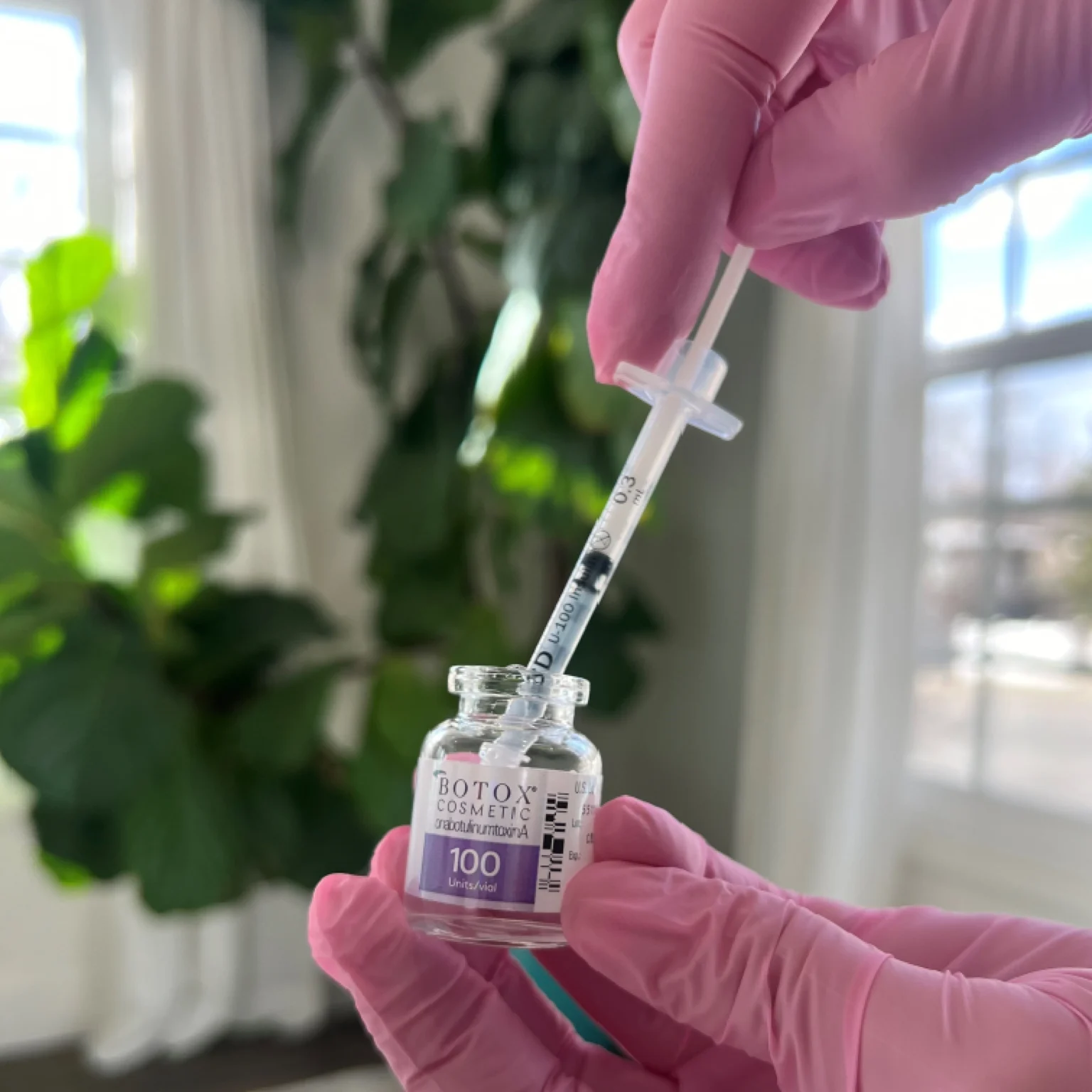 Injector filling a syringe of Botox in SLC, UT